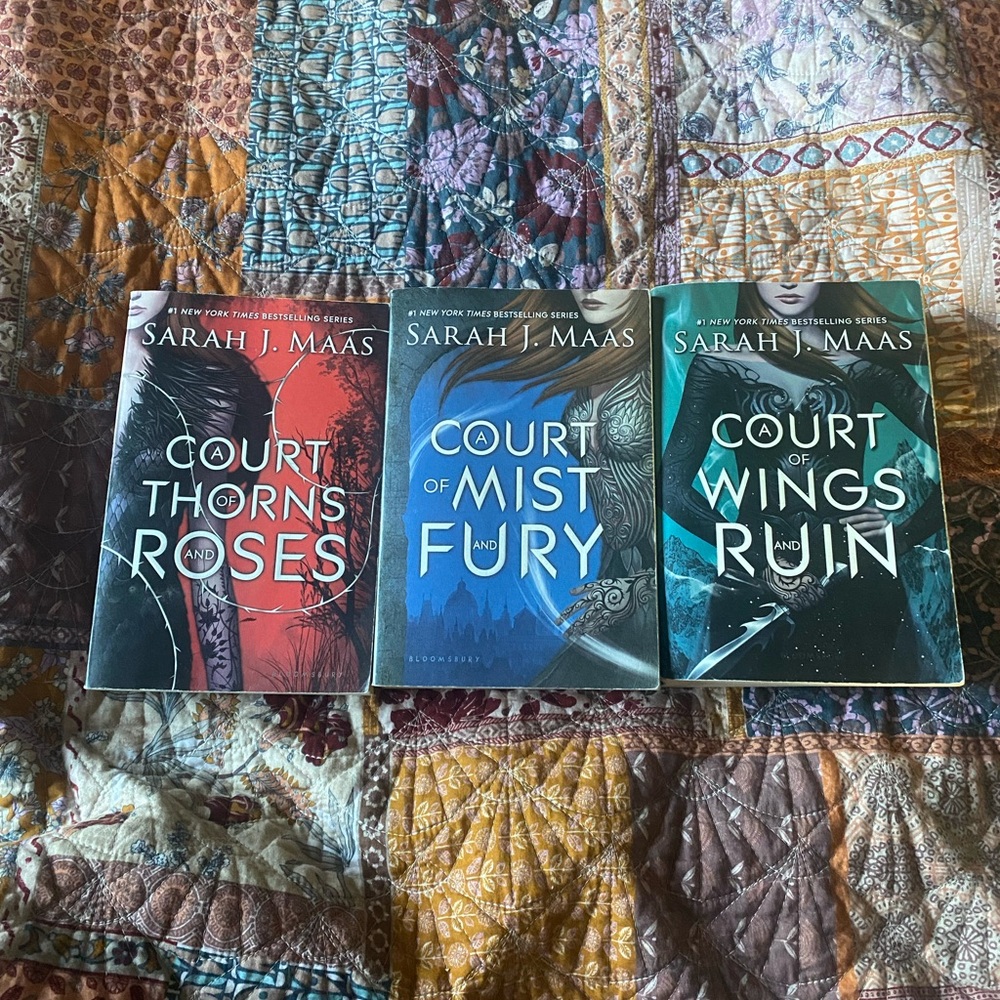 Original covers of A Court of Thorns and Roses (first 3 books)